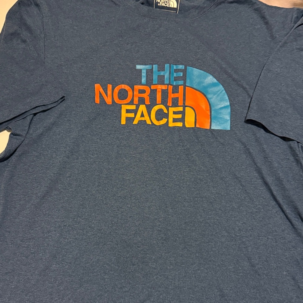 The North Face Blue Tee with Orange and Blue Logo